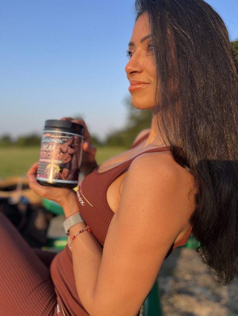 A Woman in Fitness Wear Holding a Protein Box